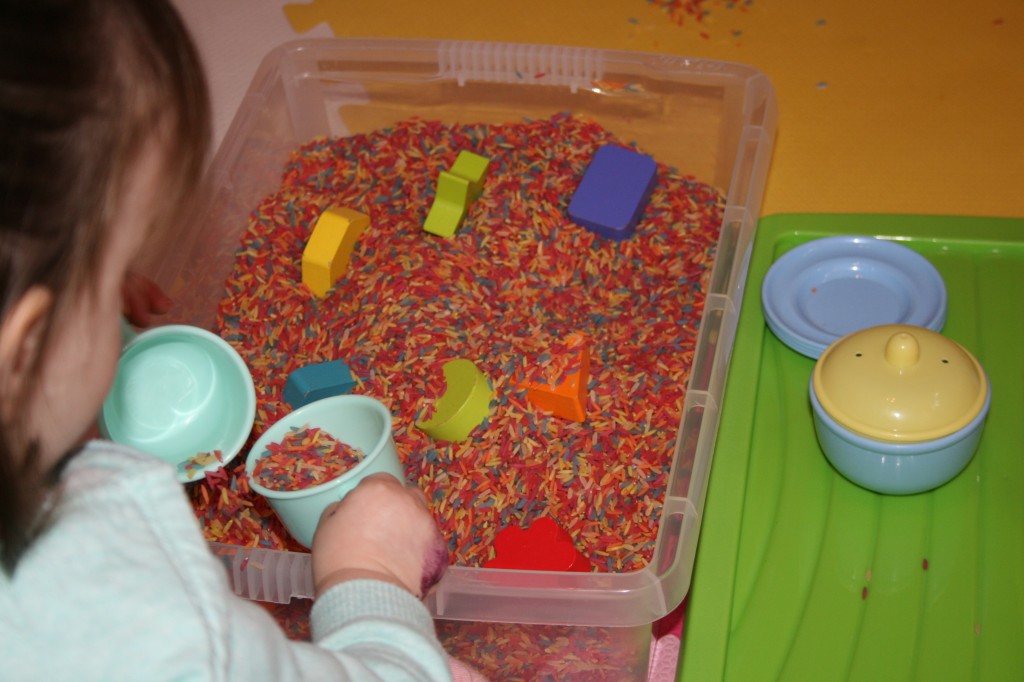 A child having fun in a messy pit