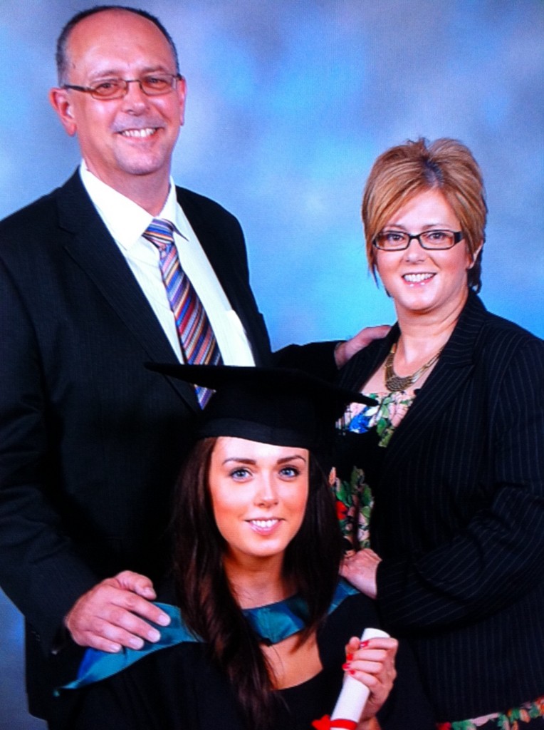 Joanna and Mike with their daughter Stephanie on her recent graduation day