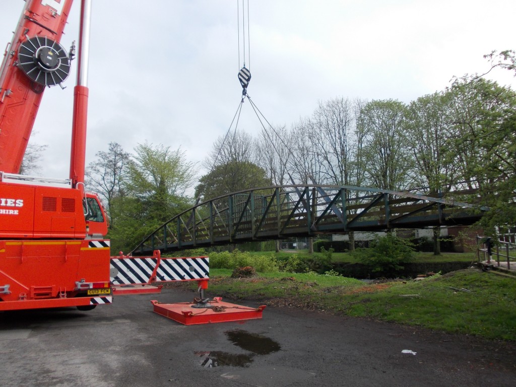 The old footbridge is lifted out