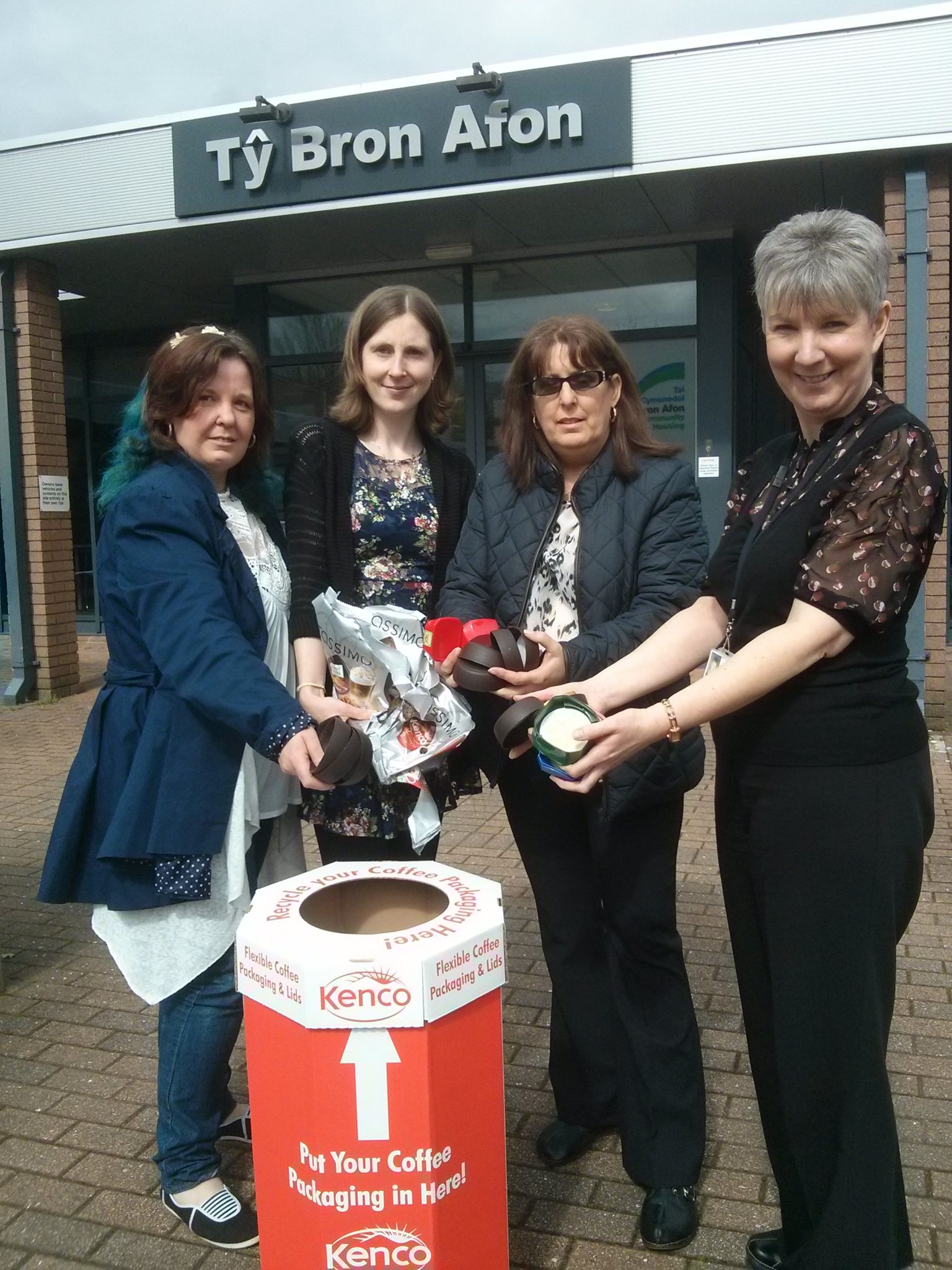 Angela Locke (Chair of the St Dials group), Kirsty Hopkins (Treasurer), Deb Rhodes (Secretary) and Tracey James, community housing officer for St Dials with the coffee recycling box at Bron Afon