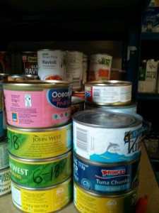 Tins of tuna on the shelves in the foodbank in Old Cwmbran