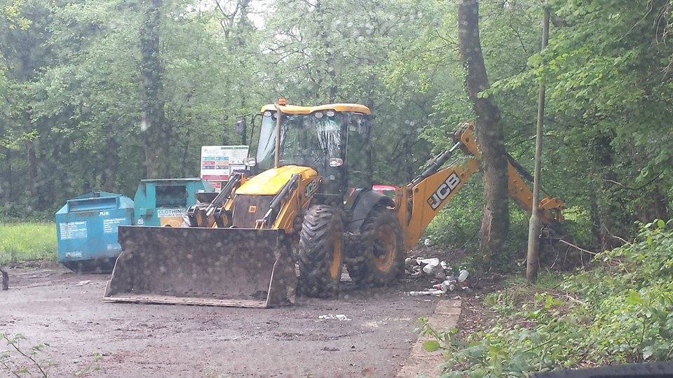 A JCB tidies up flytipping in Cwmbran