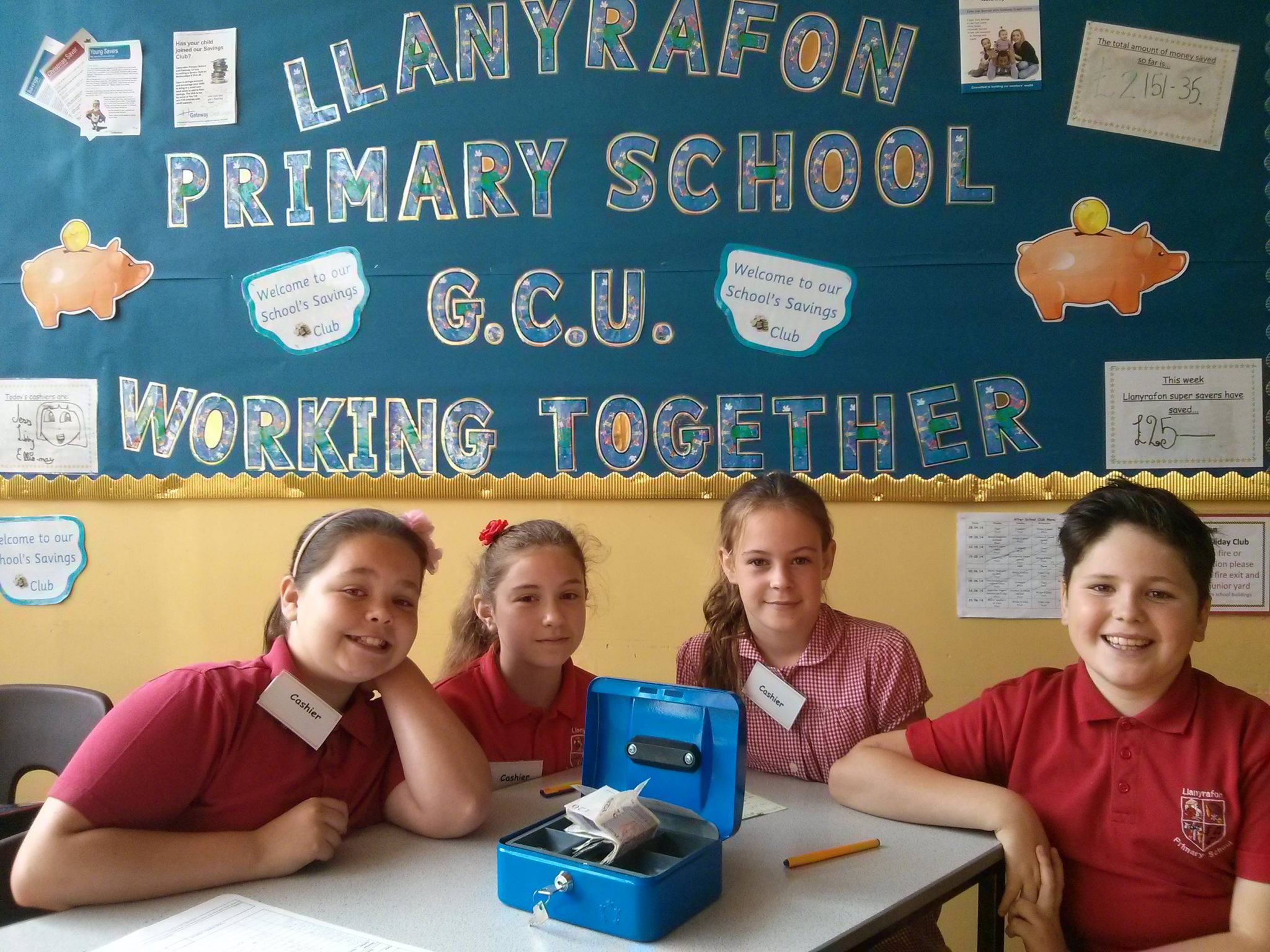 Elli-May Watkins, Elizabeth Williams, Chloe Barry and Toby Bailey- four of the cashiers at the Llanyrafon primary school credit union