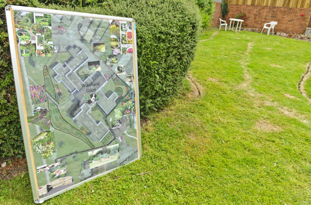 This board shows the future plans for the gardens at Woodland Court