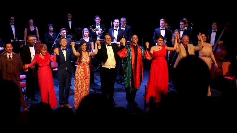 The cast and orchestra of The Mikado take a bow at the Congress Theatre