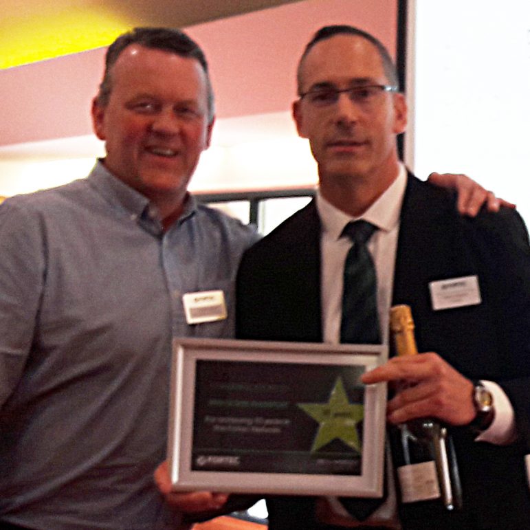 Robbie Evans (left) receives the Long Service Award from Steve Wyton, Fortec’s Regional Commercial Manager (Midlands).