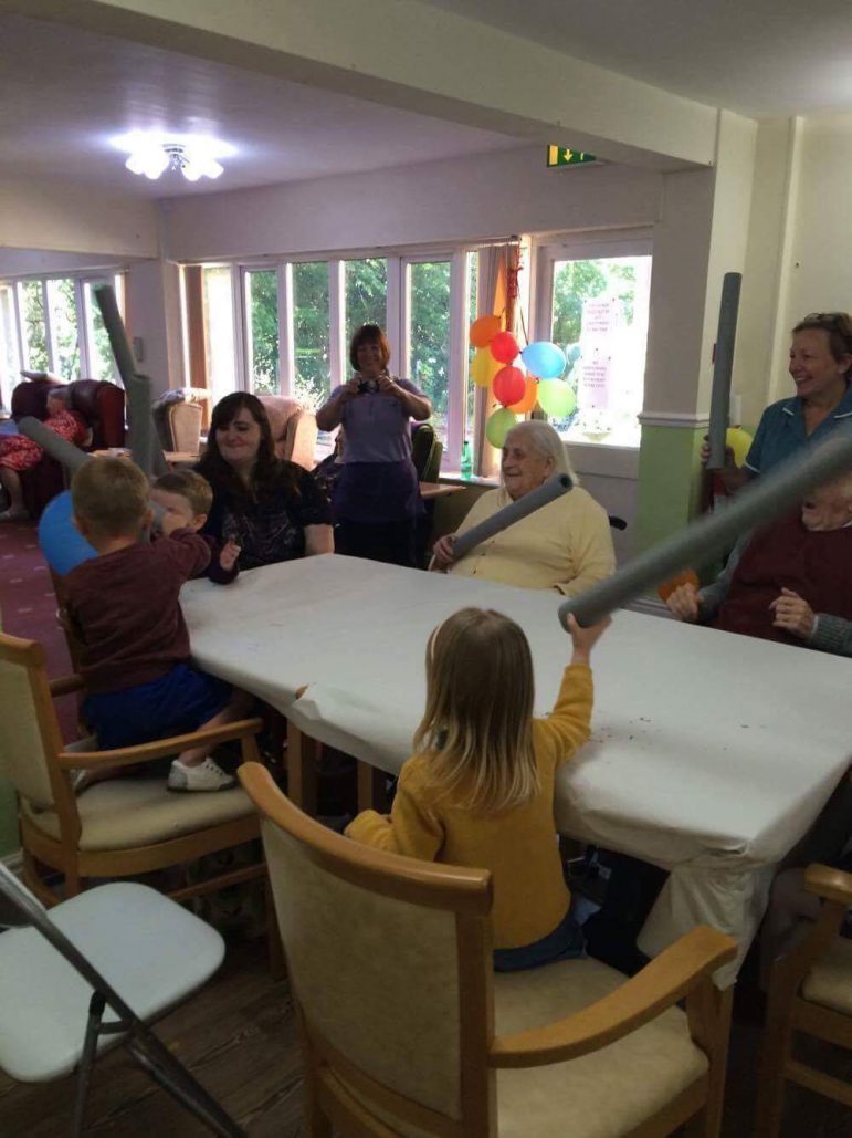 Children from Llanyrafon Nursery play games with residents at Llanyravon Care Home