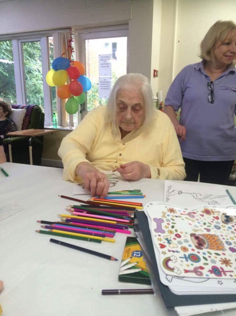 Children from Llanyrafon Nursery play games with residents at Llanyravon Care Home