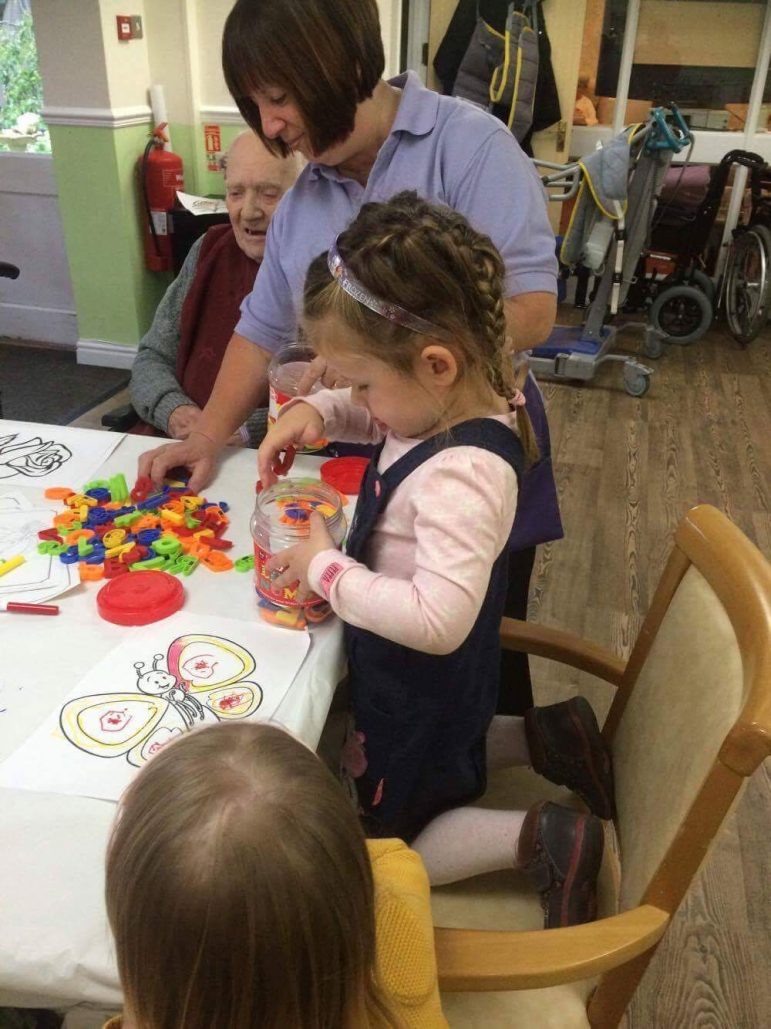 Children from Llanyrafon Nursery play games with residents at Llanyravon Care Home