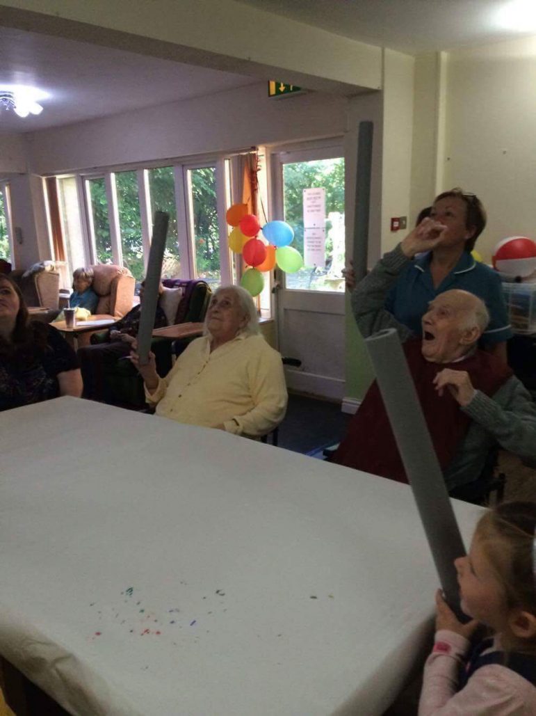 Children from Llanyrafon Nursery play games with residents at Llanyravon Care Home