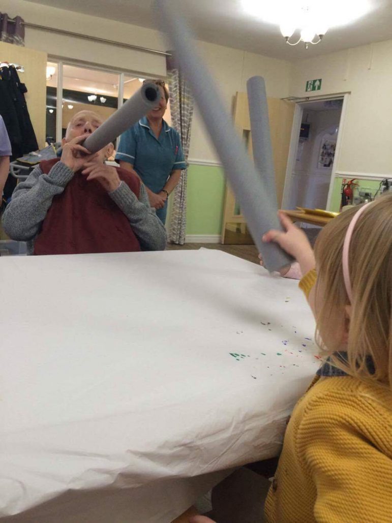 Children from Llanyrafon Nursery play games with residents at Llanyravon Care Home