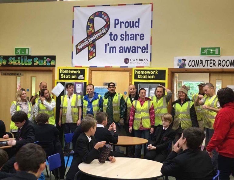 Volunteers and pupils take a break during their garden makeover at Cwmbran High School