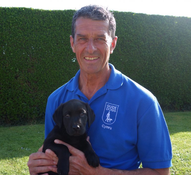 Steve Kersley, volunteer development consultant for Guide Dogs, and puppy Gwen