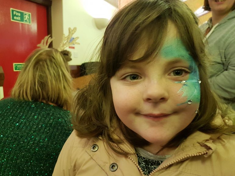 A child with her face painted at the St Dials Ward Community Group's Christmas Party