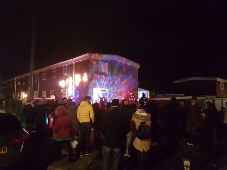 Over 50 Northville residents watching their community Christmas tree lights get turned on