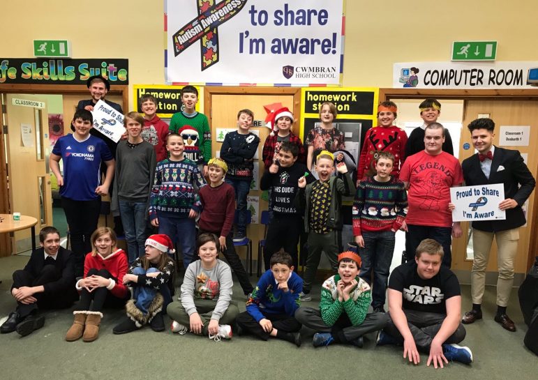 Lord Harri and Russell Jones with pupils at Cwmbran High School's autism base