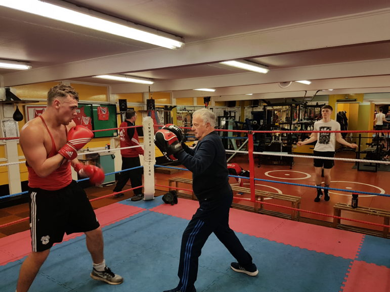 Keith Jefferies taking a boxer on the pads at Cwmbran Boxing Club