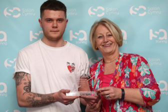 Shirley Davis-Fox MBE presenting the award to Luke Hopkins