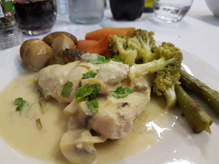 Dijon Chicken with Mushrooms served with hassleback potatoes and mixed spring vegetables