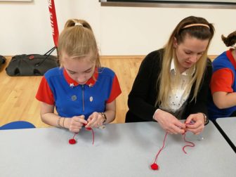 Poppies being knitted by the 2nd Fairwater Guides