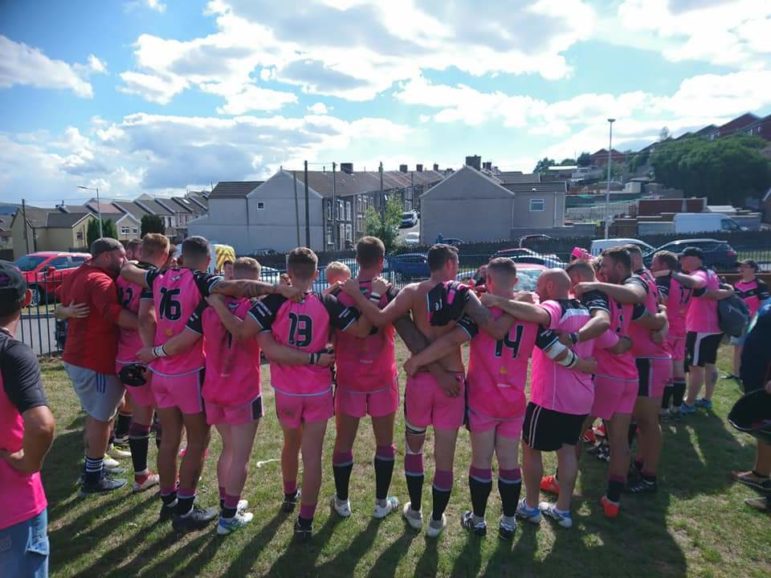 Dafydd Hellard giving his post-match team talk to the Valley Cougars from his car