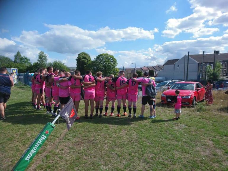 Dafydd Hellard giving his post-match team talk to the Valley Cougars from his car