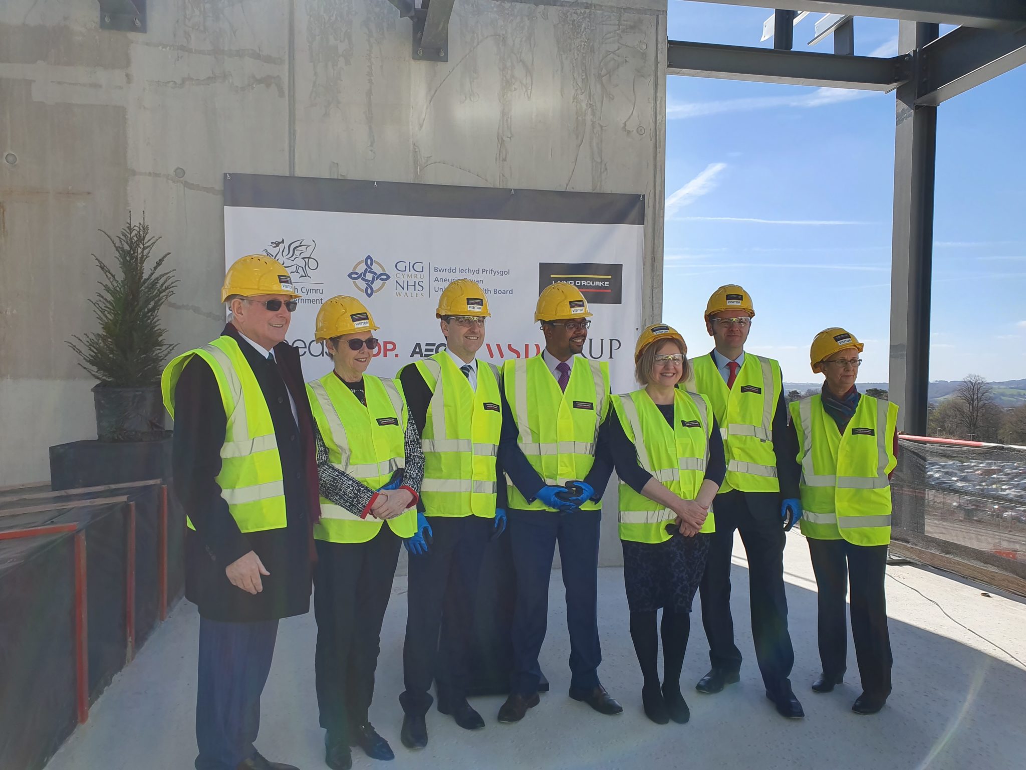 Vaughan Gething AM, Minister for Health and Social Services, and guests at the topping out ceremony