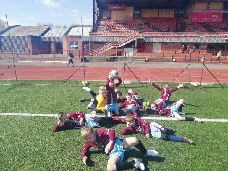 Cwmffrwdoer Primary School football team relax after the tournament