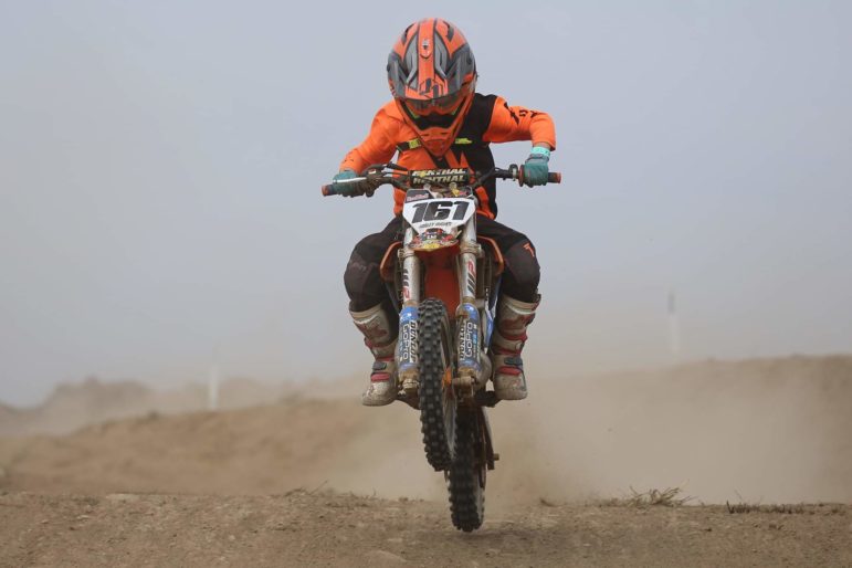 Harley Hughes racing on a motocross bike