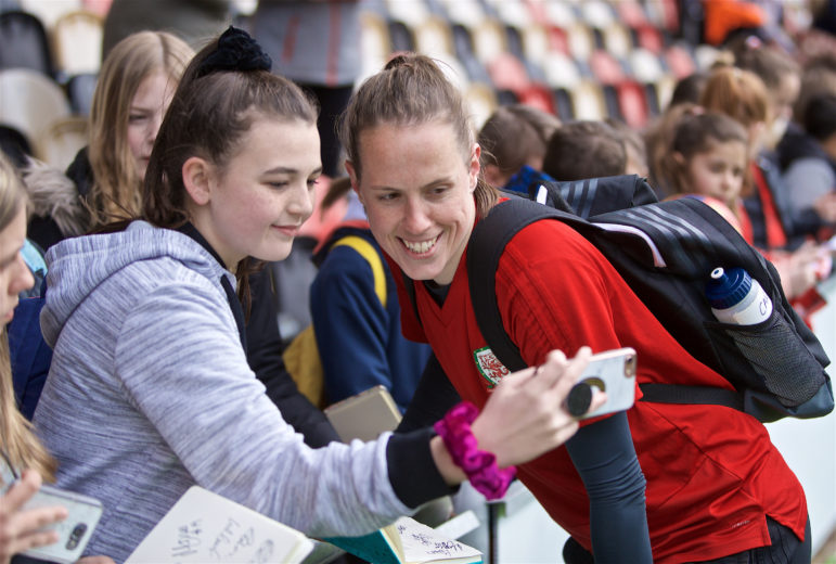 Wales' goalkeeper Laura O'Sullivan and a fan