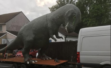 The Cwmbran dinosaur on a trailer