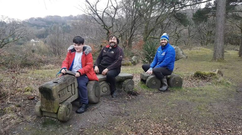 Jerry playing on the wooden train at Blaen Bran Woodland in Upper Cwmbran