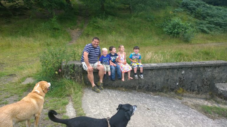 Jerry with four of his grandchildren and two of his dogs