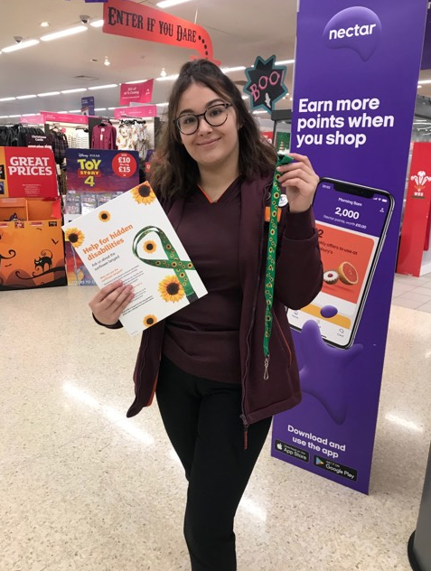 Staff member at Cwmbran Sainsbury's with a sunflower lanyard