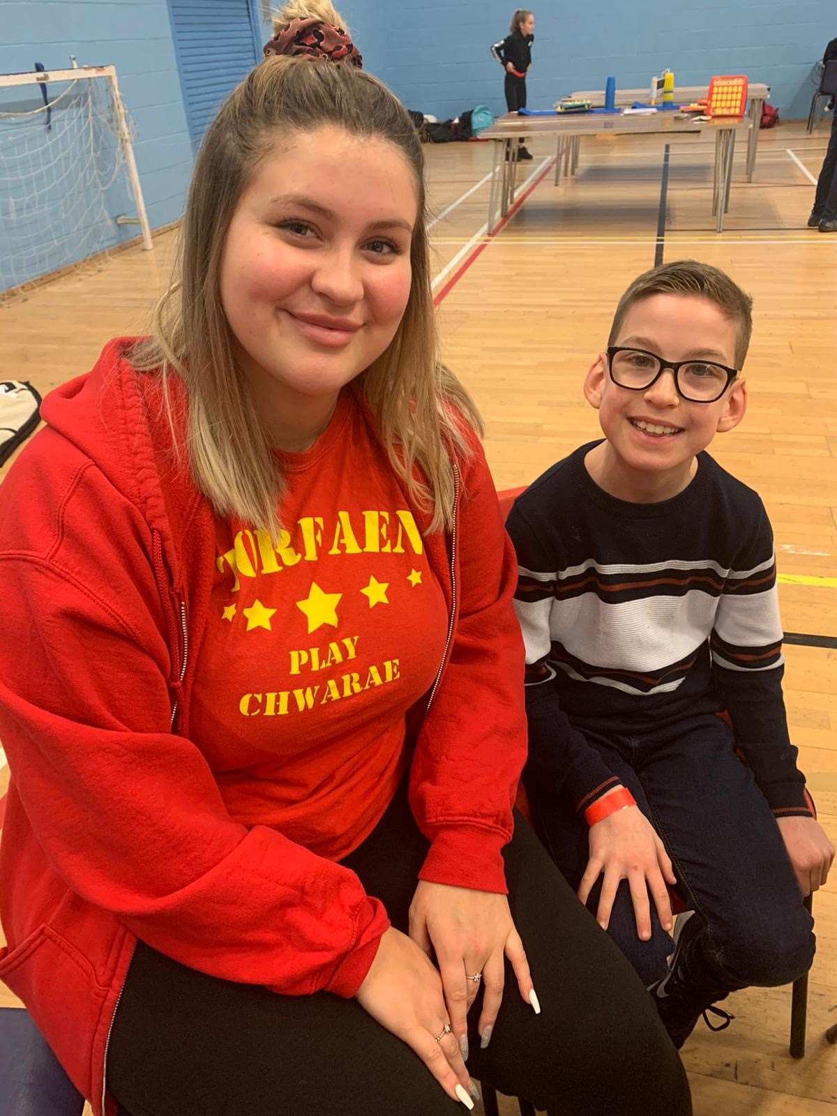 A young person and volunteer at a Torfaen playscheme