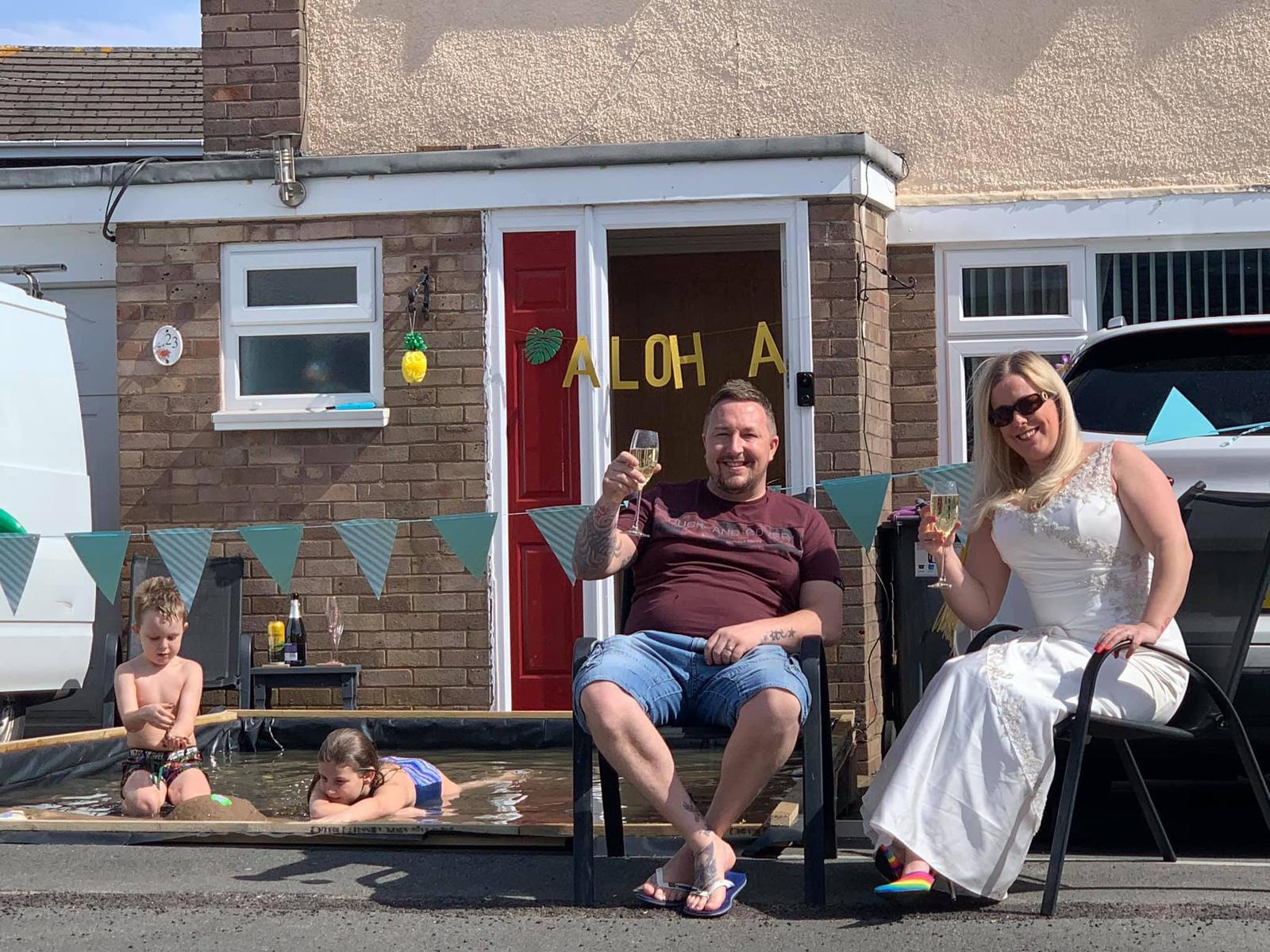 The Fry family celebrating on their driveway