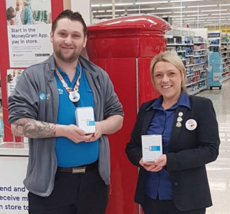 Two people stood in a supermarket