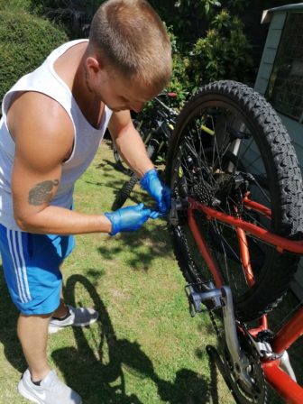 Nathan Shephard fixing a bike