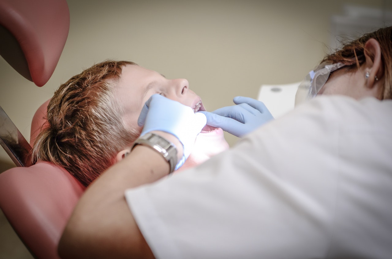 A child being treated by a dentist