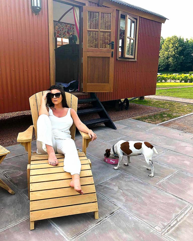 A dog and owner outside the Shepherd's Hut