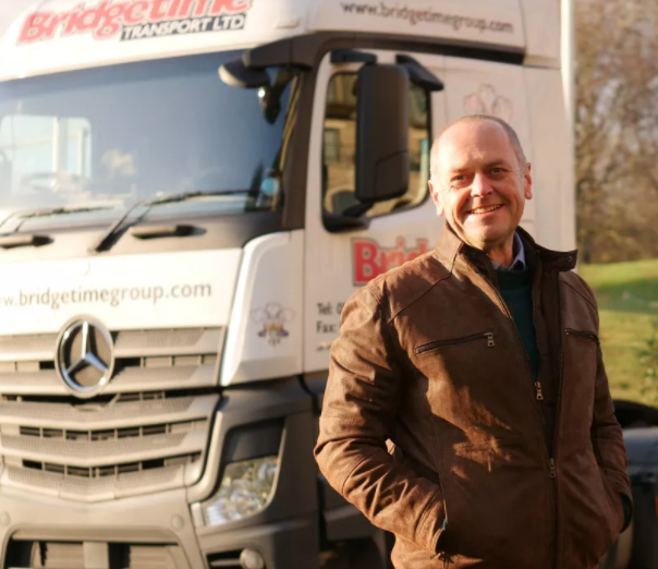 Jason Dury stood in front of a truck