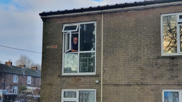 Bob looking out of his window