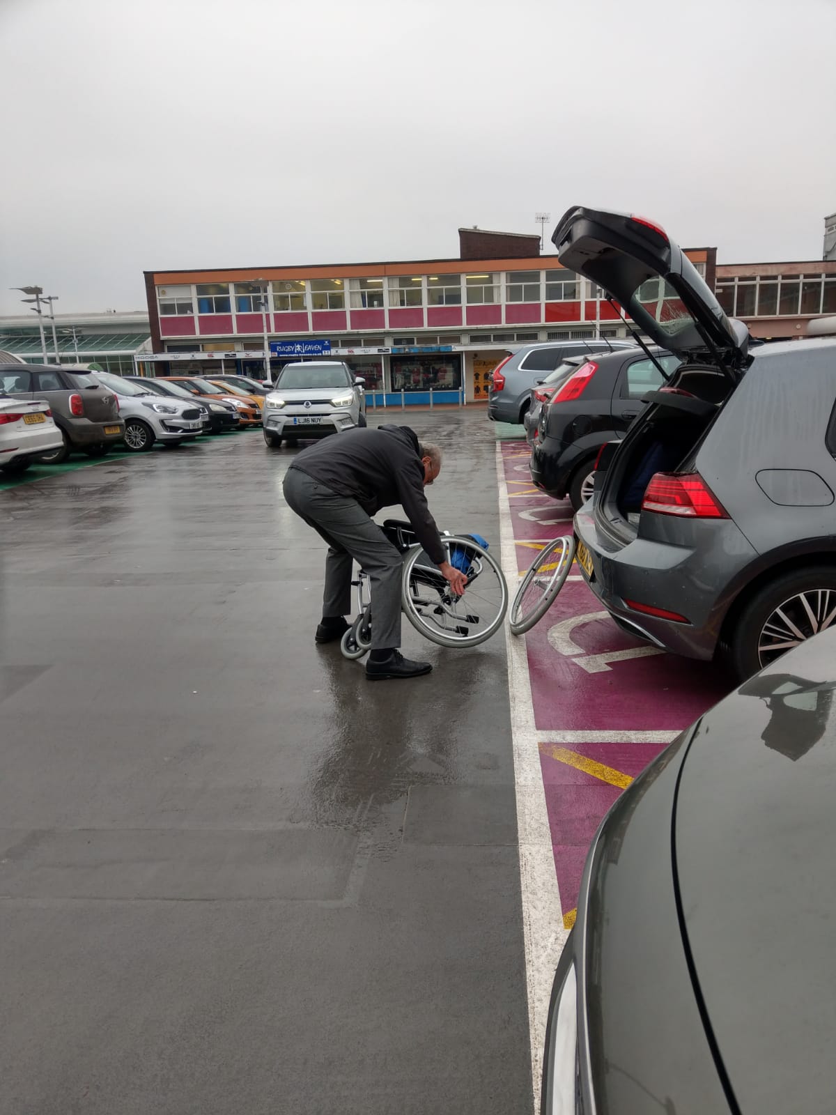 Man puts wheelchair in car book