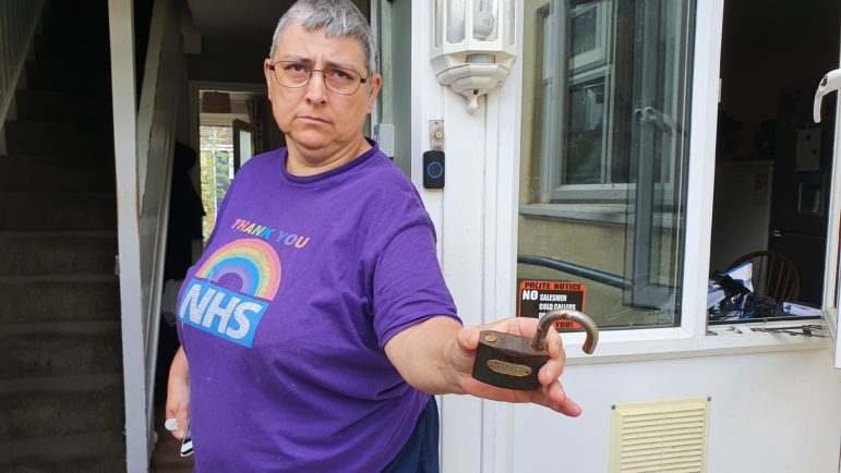 Julie holding the padlock