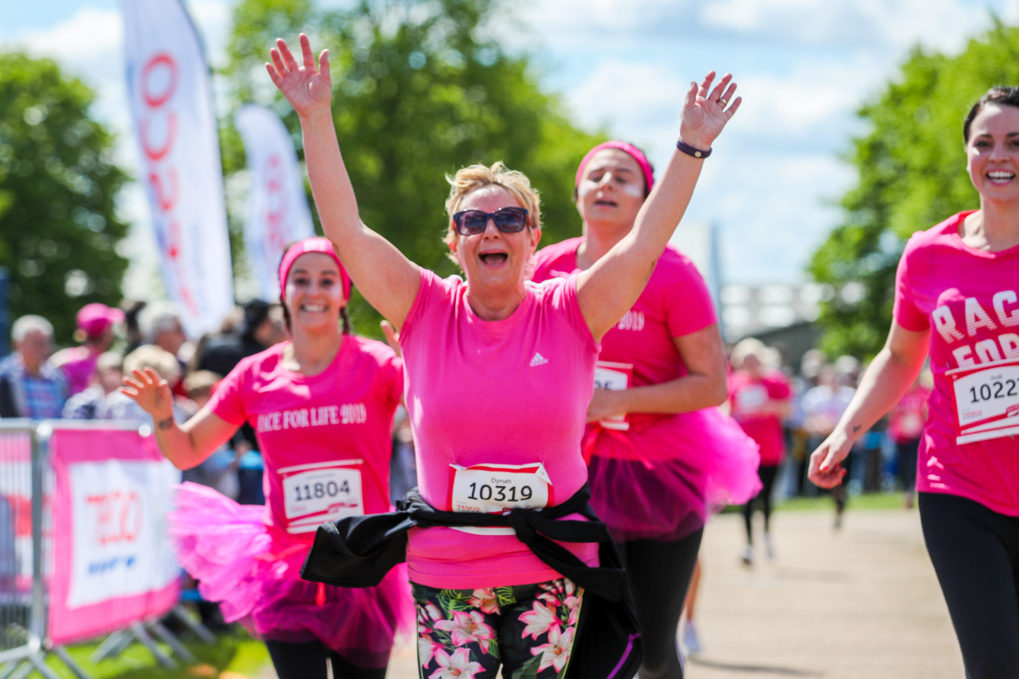 A running in pink finishes a race