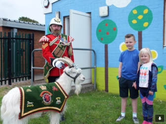 Gregor and his sister Isla with the goat and goat major