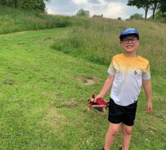 Michael walking in a field