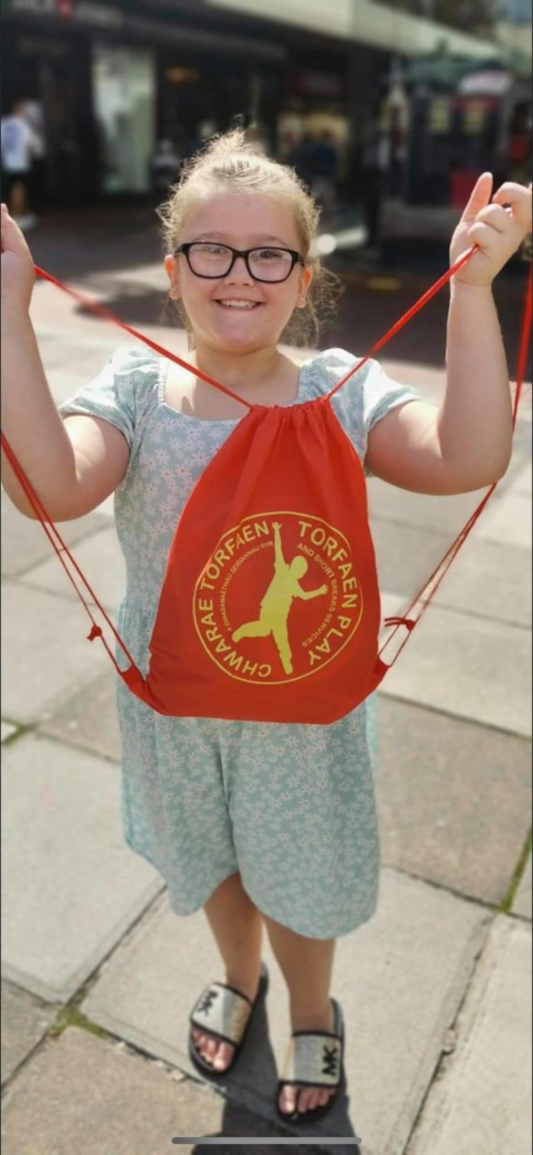 A child with her play pack