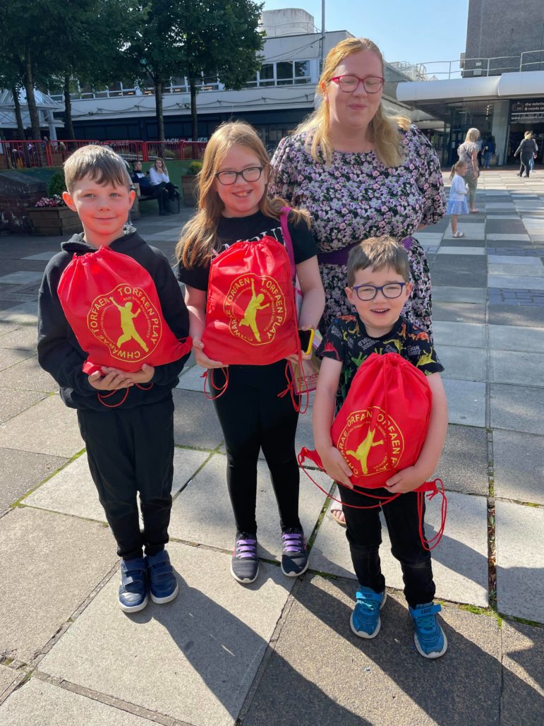 Children with their play packs