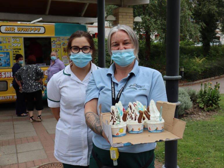 Two women with a tray of ice creams